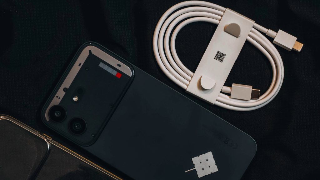 Nothing Phone (4b) with charging cable